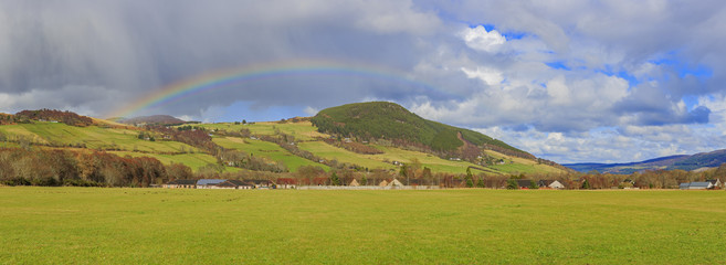 Beautiful rainbow with fields, houses