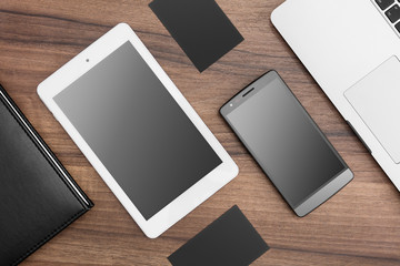 Responsive web designer desk with tablet, smartphone and MacBook