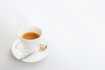 White cup of coffee on white wood table