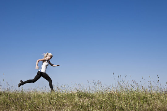 Young fit woman running to be in proper shape