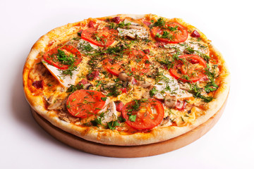 Pizza with ham, tomatoes and mushrooms isolated on white