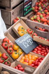 fresh tomatoes at market stall