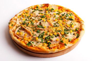 Pizza with ham and corn isolated on white