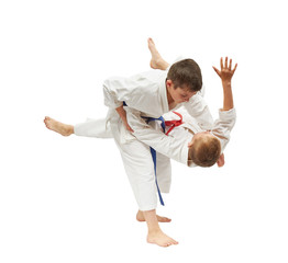 Children on a white background are doing throws