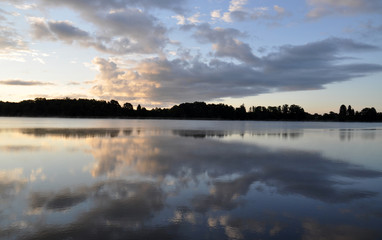 Fototapeta na wymiar summer trip to countryside - sunrise over the lake