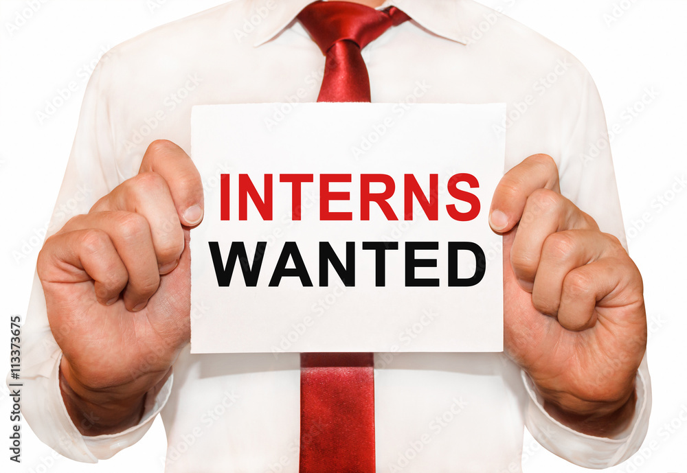 Poster man holding a card with a text interns wanted