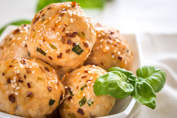 Chicken meatballs under sweet chili pepper sauce