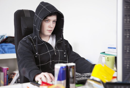 Young woman sitting concentrated by computer