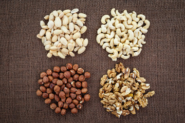 Almonds, cashew, walnuts and hazelnuts lying on burlap