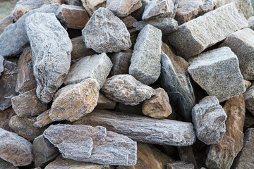 Closeup of granite stones covered with hoarfrost, winter background
