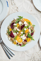 Warm Healthy quinoa, brown rice, cooked beetroot and orange sala