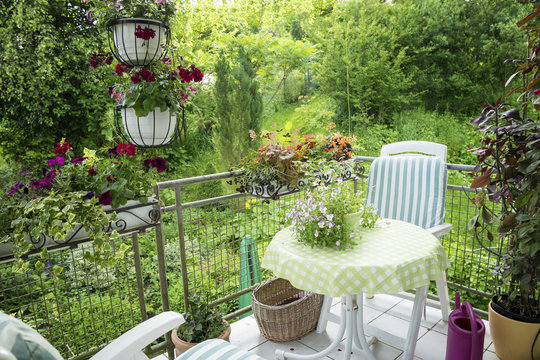 Summer Terrace or Balcony with small Table, Chair and Flowers