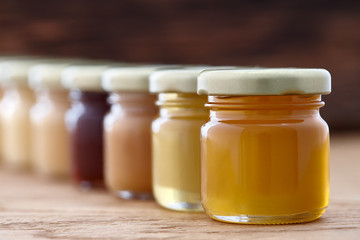 Different kinds of honey in a row