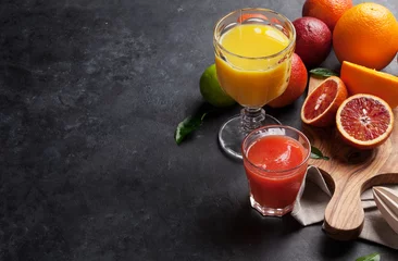 Zelfklevend Fotobehang Fresh citruses and juice © karandaev