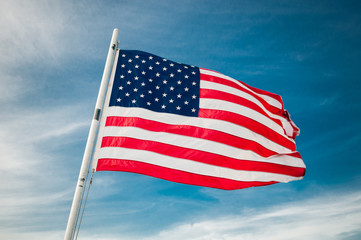 American flag against bright blue sky