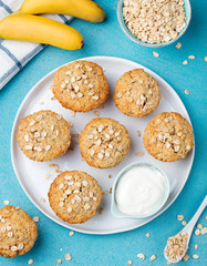 Healthy vegan oat muffins, apple and banana cakes with sour cream Blue stone background