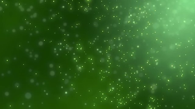 Abstract sharp and blurred  particles swarming against green background