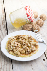 Pancakes with walnut and caramel for a breakfast