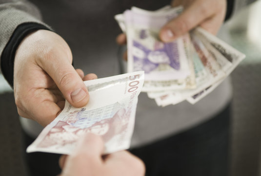 Man giving bills