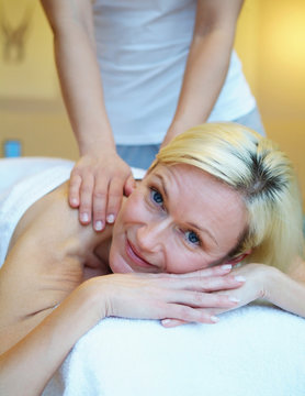Relaxed woman recieving a massage