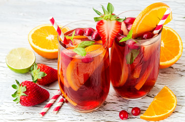 Cranberry drink, homemade lemonade or sangria with citrus fruits