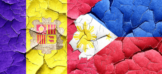 Andorra flag with Philippines flag on a grunge cracked wall