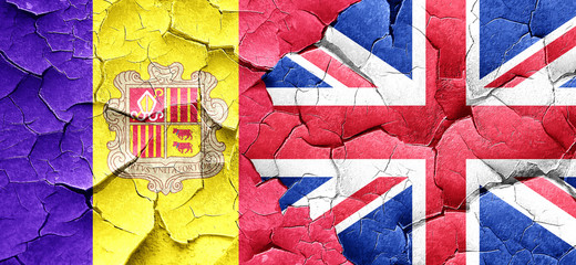 Andorra flag with Great Britain flag on a grunge cracked wall