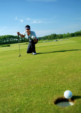 Cheering man making the put