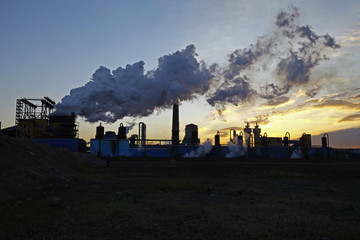 Industrial plant equipment in the sunset
