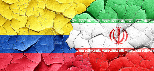 Colombia flag with Iran flag on a grunge cracked wall