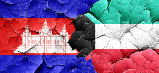 Cambodia flag with Kuwait flag on a grunge cracked wall