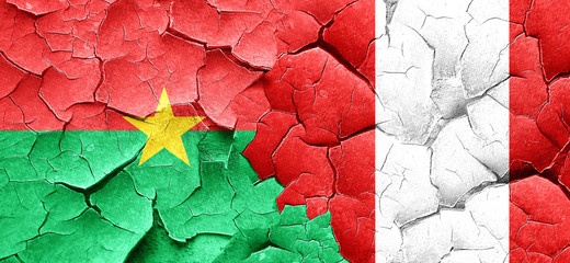 Burkina Faso flag with Peru flag on a grunge cracked wall