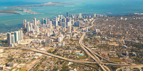 The City of Miami, Florida with Downtown and Key Biscayne. Boats are riding in a bay of Atlantic Ocean. - obrazy, fototapety, plakaty