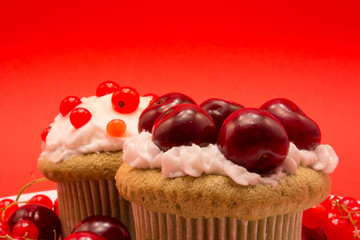 Sweet cupcakes with berries and cherries