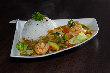 shrimp and vegetables served with stemmed rice