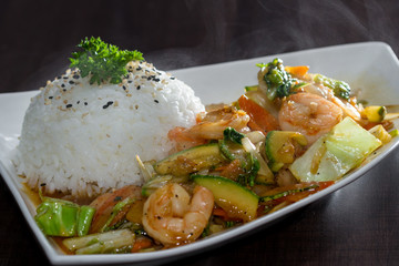 shrimp and vegetables served with stemmed rice