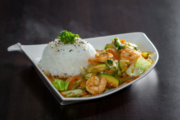 shrimp and vegetables served with stemmed rice