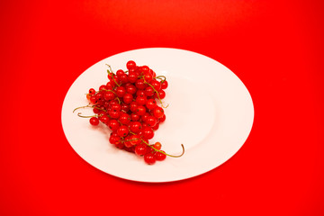 Red fruit in white plate