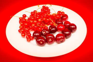 Red fruit in white plate