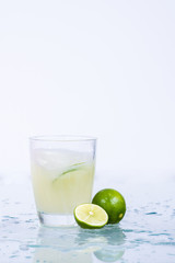 Fototapeta na wymiar Lemon juice in a glass.Isolated on white.