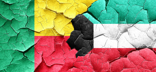 Benin flag with Kuwait flag on a grunge cracked wall