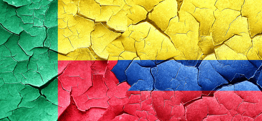 Benin flag with Colombia flag on a grunge cracked wall