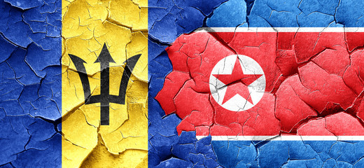 Barbados flag with North Korea flag on a grunge cracked wall