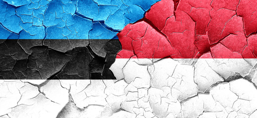estonia flag with Indonesia flag on a grunge cracked wall