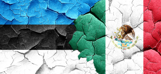 estonia flag with Mexico flag on a grunge cracked wall