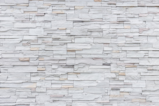 Pattern of grey and rough sandstone wall texture for background