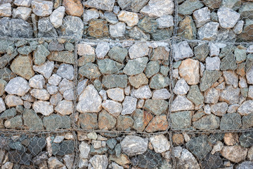 Pattern of grey stone wall with metal grid texture for backgroun