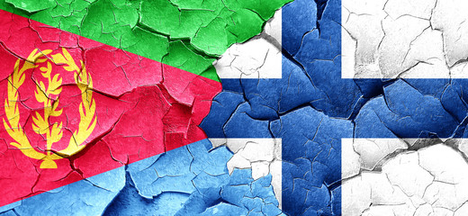 Eritrea flag with Finland flag on a grunge cracked wall