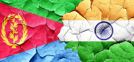 Eritrea flag with India flag on a grunge cracked wall