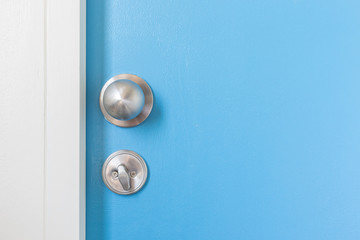 Metal silver doorknob on wooden door - obrazy, fototapety, plakaty